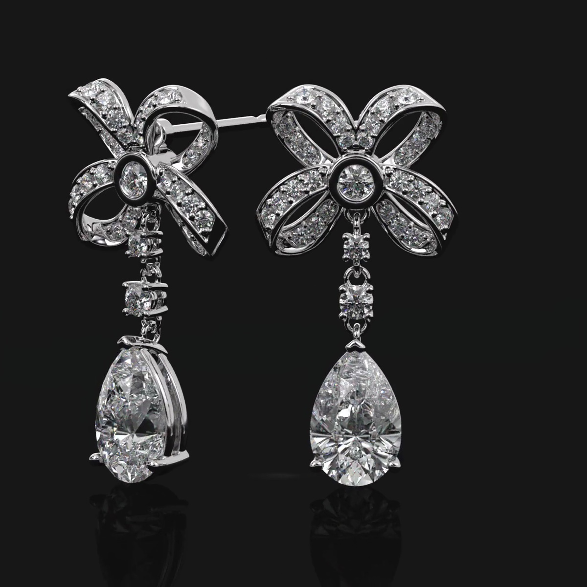 A Platinum Emperor Drop Earring Commission, Set with Matched Pear Diamonds
