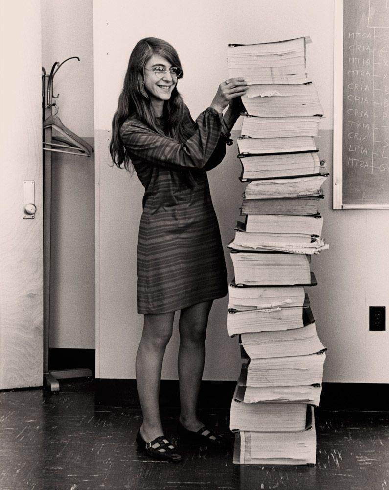 "Margaret Hamilton standing next to listings of the software she and her team at the Massachusetts Institute of Technology (MIT) produced for the Apollo project," 1969. 