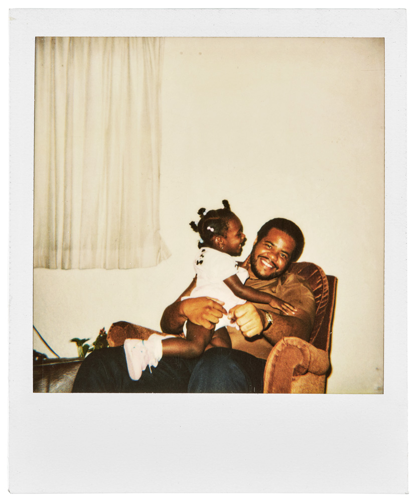 Zun Lee, [Man with moustache crouching and hugging twin boys], 19801990. Instant print (Polaroid SX70), 10.8 x 8.8 cm. Art Gallery of Ontario, Fade Resistance Collection, purchase, with funds donated by Martha LA McCain, 2018. 2018/2576. Digital image:  Art Gallery of Ontario. From 