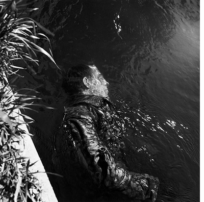 Lee Miller: Dead SS Guard, Floating in Canal, Dachau
