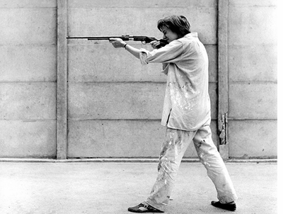 Niki de Saint Phalle shooting at the Impasse Ronsin, 1961