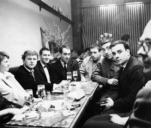 Photo of Margret Mack, Heinz Mack, Otto Piene, Jean Tinguely, Daniel Spoerri, Pol Bury, Yves Klein and Emmett Williams after the opening of Vision in Motion is reproduced from