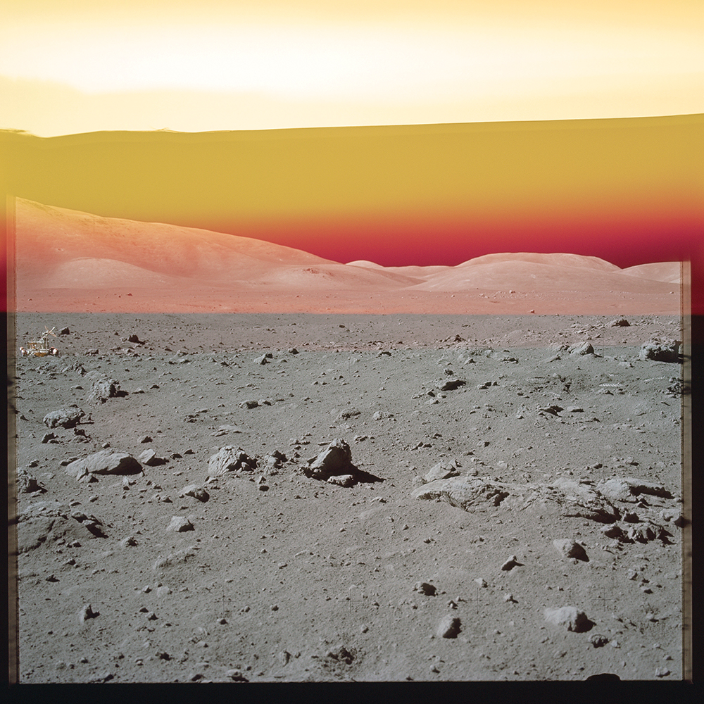 Station 9 partial pan with the rover, in front of the East Massif. Photo by Gene Cernan. [Apollo 17] From 