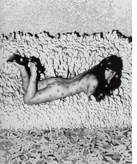 Featured image, an undated photograph of the artist on one of her late-60s <I>Accumulation</I> pieces, is reproduced from <a href="9781935202813.html">Yayoi Kusama</a>