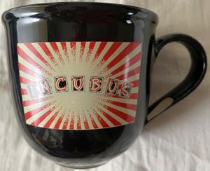 Incubus Light Grenades album 2006 black ceramic coffee mug (never used but handle repaired)