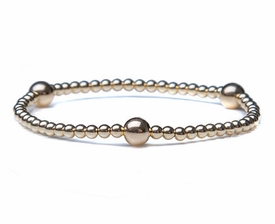 14k Gold Bracelet with 3 Accent Balls and Beads