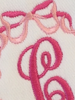 embroidered initial burp cloth with bows