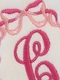 embroidered initial burp cloth with bows