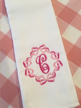 embroidered initial burp cloth with bows