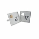 framed silver cuff links with raised and cutout accents