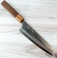 Visit Taguchi Ginsan Damascus Santoku 180mm