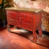 Red Chiro TV Stand with Ox Yoke Carved Legs