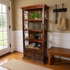 Rustic Red Painted Wood Book Shelf with Iron Scrolls and Iron Panel Doors