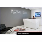 KIRIGAMI RECEPTION DESK. EACH FACET IS HAND FITTED. THE DIAMOND OF RECEPTION DESKS: Priced from $34,000 depending on the size and layout.