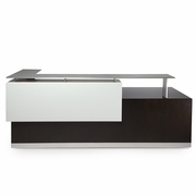 THE ABSTRACT FORM OF THE KUBIST RECEPTION DESK IS FUNCTIONAL ART. THE MONOCHROMATIC COLOR TONES CREATE A CALM SETTING. Priced from $32,000 depending on the size and layout.