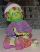 Click - Boy With Lizard Arm Statuette Figurine