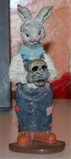 Click - Rabbit Boy holding Skull Statuette Figurine