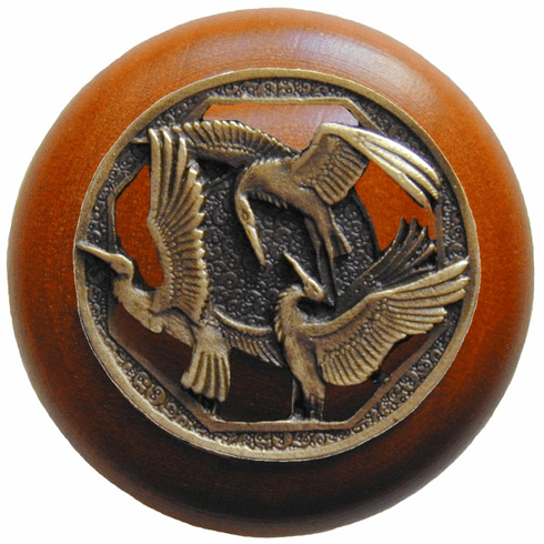 NHW-737C-AB Crane Dance Wood Knob in Antique Brass/Cherry wood finish 1-1/2" Dia 1-1/8" Proj Lodge & Nature Collection by Notting Hill