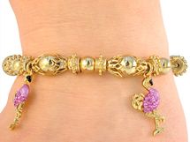 Flamingo pink rhinestone and enamel goldtone bracelet