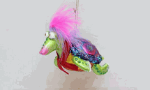 December Diamonds Painted glass turtle with feather holiday ornament