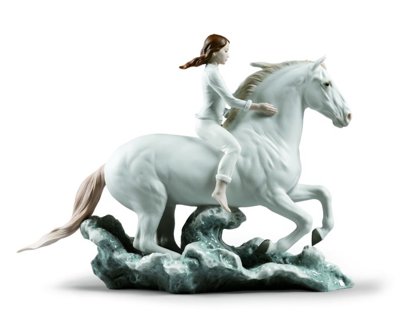 01009371 Riding her horse on the seashore