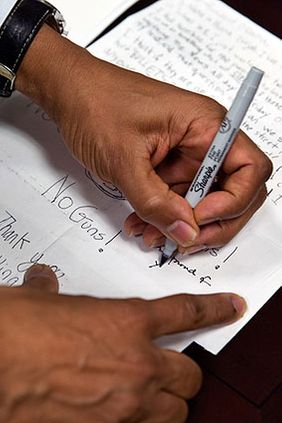 President Obama Signs Letters from Children Photo Print