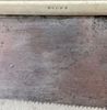 Close up view of manufacturer:
