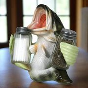 Salt and Pepper Shakers Bass holding s&p