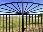 Metal Center Divide Sunburst Driveway Entry Gate.