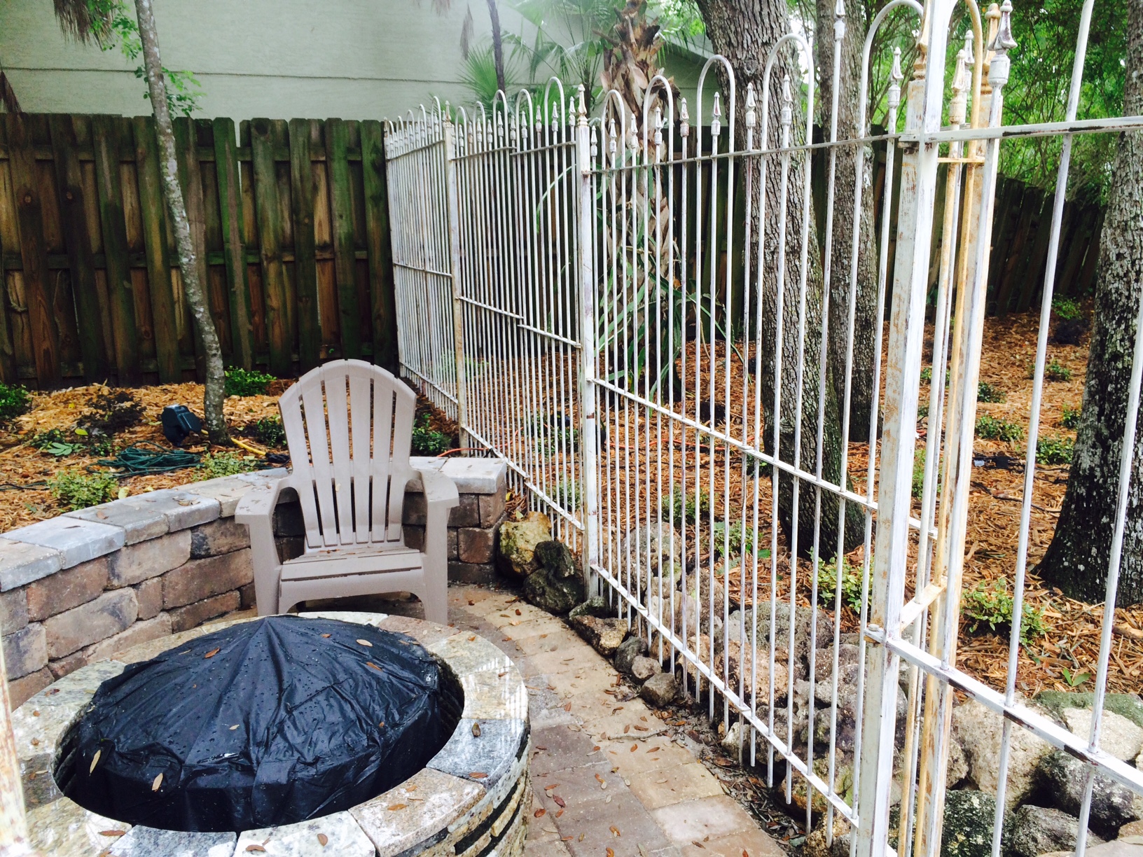 6 Foot Wrought Iron Fence Installed on a Grade