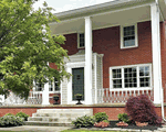 Before & After: Classic Cast Iron Urns Transform This Front Entrance