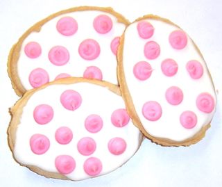 1/2 Pound White Iced Egg Shaped Sugar Cookies with Pink Polka-Dots in a Decorative Bag