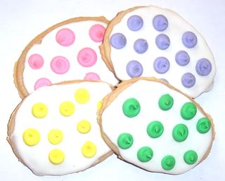 1 Pound White Iced Egg Shaped Cookies with Mixed Polka-Dots in a Decorative Tray with Krinkle