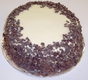 Chocolate Cake with Your Choice Fudge and Filling - White Chocolate Topping - Decorated with Dark Chocolate