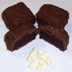 Milk Chocolate Covered Brownie Bites with White Chocolate Chips in a Small Tin