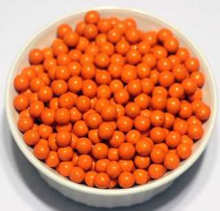 Orange Sixlets in a 1 Pound Container