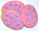 Pink Iced Egg Shaped Sugar Cookies with Lavender Polka-Dots in a Small Tin