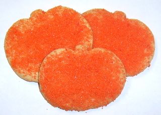 Pumpkin Shaped Sugar Cookies with Colored Sugars in a Large Tin