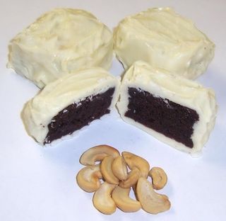 White Chocolate Covered Browine Bites with Cashews in a Pail