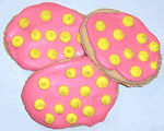 White Iced Egg Shaped Sugar Cookies with Yellow Polka-Dots in a Pail