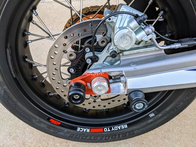 What are the best axle sliders for the KTM 690 and Husqvarna 701 ?