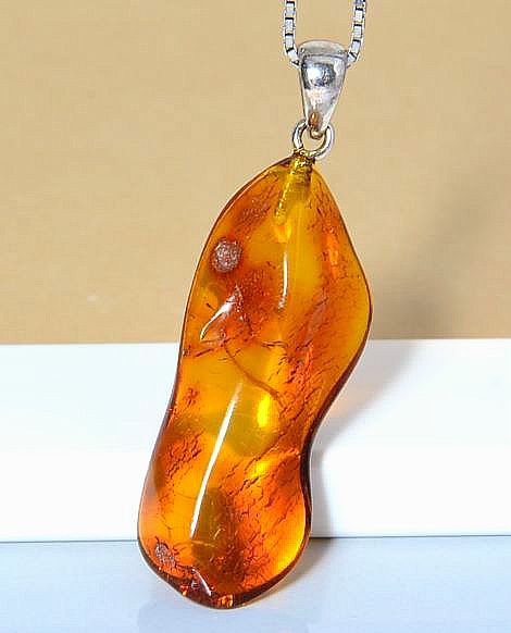 Baltic Amber Amulets Made of Natural Shape Cognac Color Amber Rock.