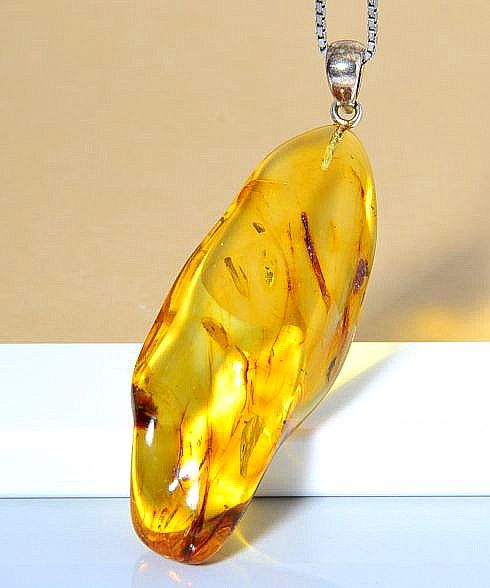 Baltic Amber Amulets Made of Natural Shape Honey Color Amber Rock.