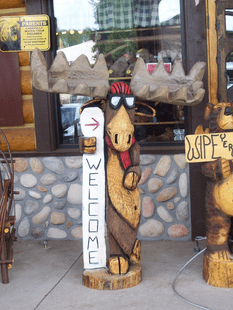 CUSTOM SNOWBOARDER MOOSE CHAINSAW CARVING