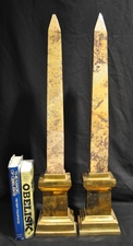 Tall specimen marble obelisks on brass plinths