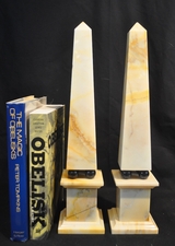Vintage cream marble obelisks with black marble ball mounts