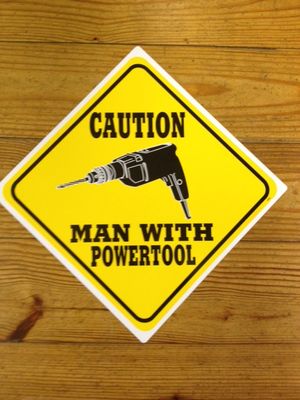 Caution Man With Powertool Sign