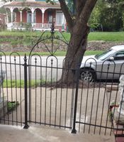 Wrought Iron Gate Way Installed Over Sidewalk