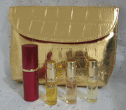 Estee Lauder Gift Set with Beautiful, Sensuous and Pleasures Parfum Sprays, Atomizer and Clutch  - no box