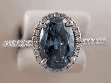 1.12 CTW BLUE OVAL CUT DIAMOND RING
